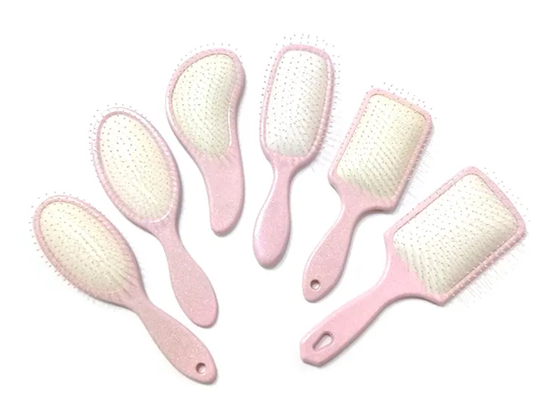 Vaaleanpunainen muovinen Fancy Paddle -hiusharja